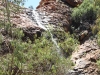 Waterfall into the sacred waterhole at Kathleen Springs