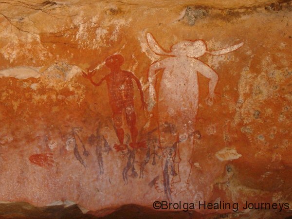 Large Spirit beings, Wandjina period, Munurru art-site, the Kimberley.  Notice the older Gwion Gwion figures at the bottom.