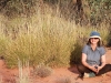 Nirbeeja takes a well-earned break beside some spinifex at the end of a long day.