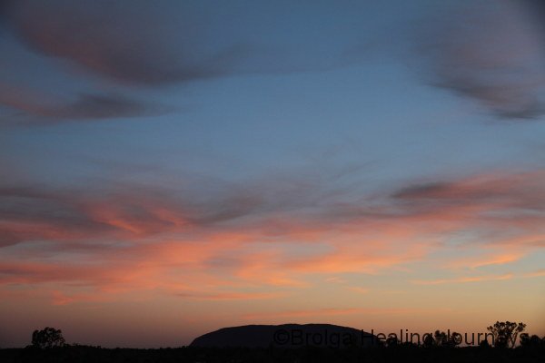 A pastel sunset over Uluru.  The whole sky was lit up.  See photos also on Kata Tjuta blog entry