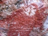 Close-up of Langurrngurru Wandjina. Notice two small spirit figues beneath the Wandjina's feet.