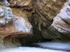 The southern entrance to Tunnel Creek.  Notice figures entering the tunnel.  Rock art to the right of area shown.