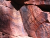 More fine work, close parallel lines engraved in rock